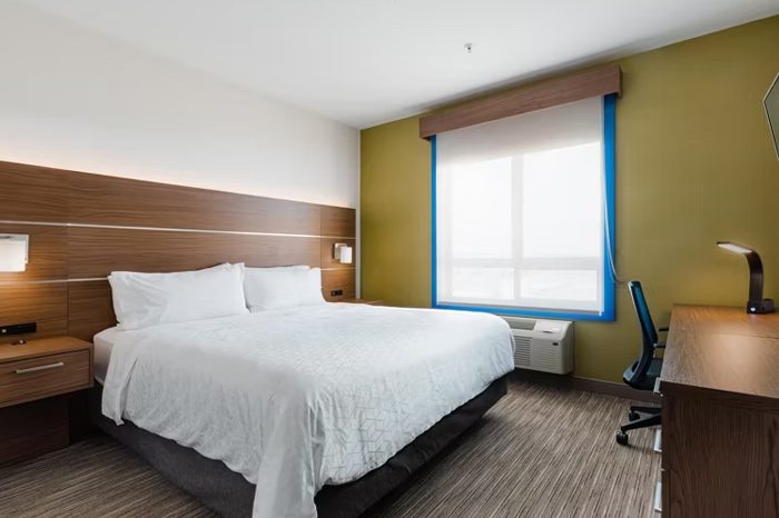 King bed standard room with work desk and window at Holiday Inn Express Grande Prairie